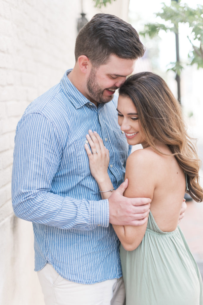 A couple embracing showing what to wear to your engagement session
