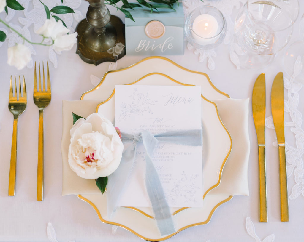 A gorgeous elegant place setting for a bride designed by the Charleston wedding planner