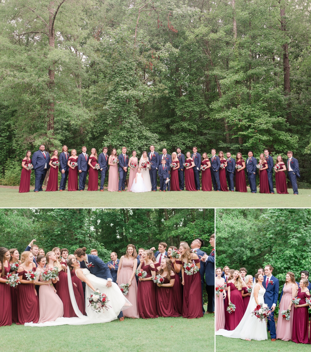 very large wedding party lined up for photos outdoors of this wedding set at enchanted acres
