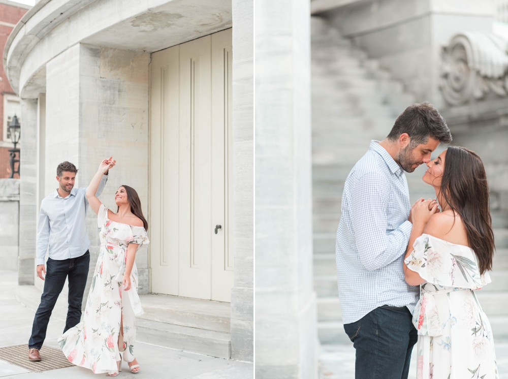 couple being sweet at merchants exchange building near Washington square park for engagement photos