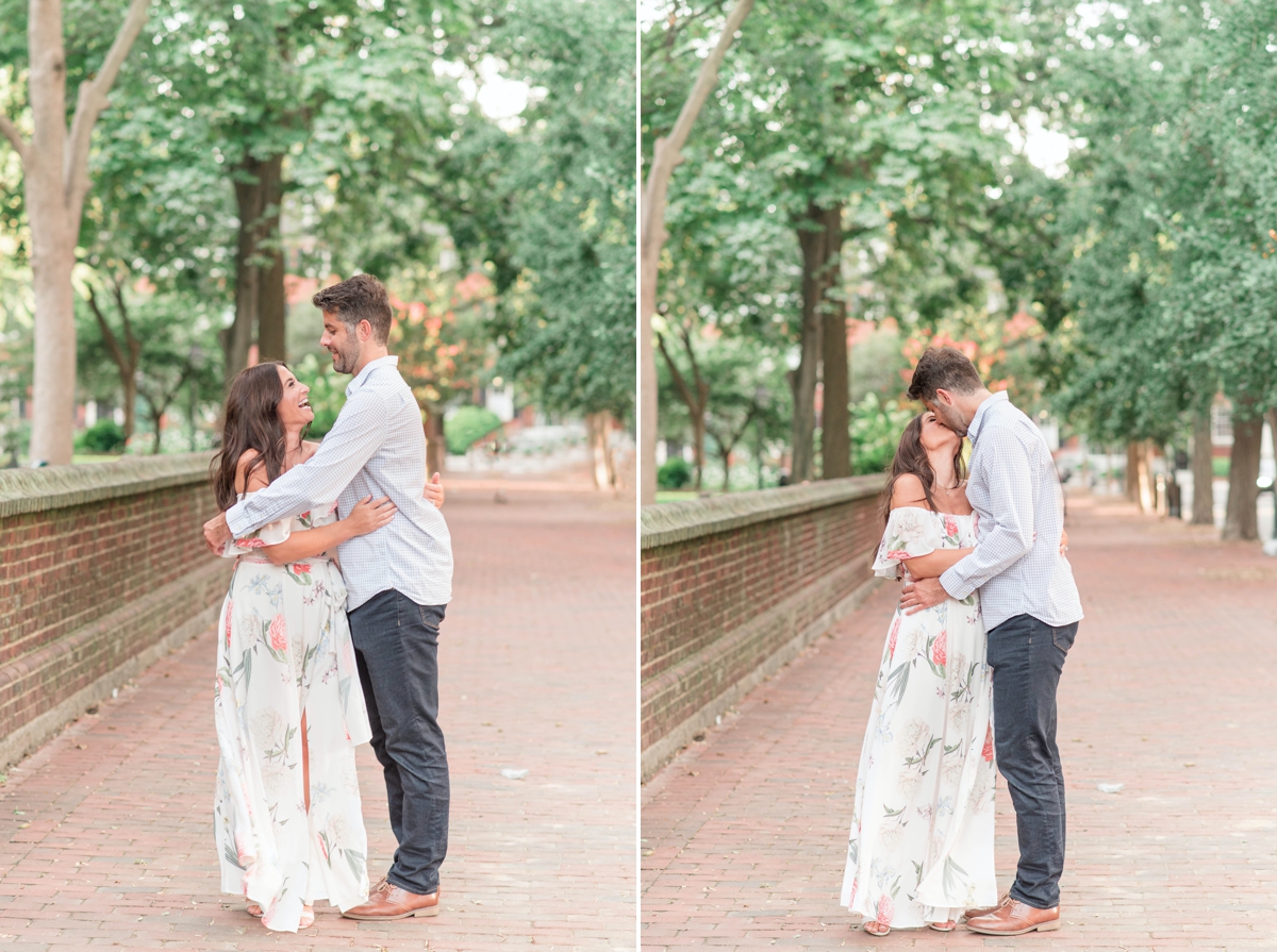 a couple walking and laughing right outside of Washington square park for engagement portraits