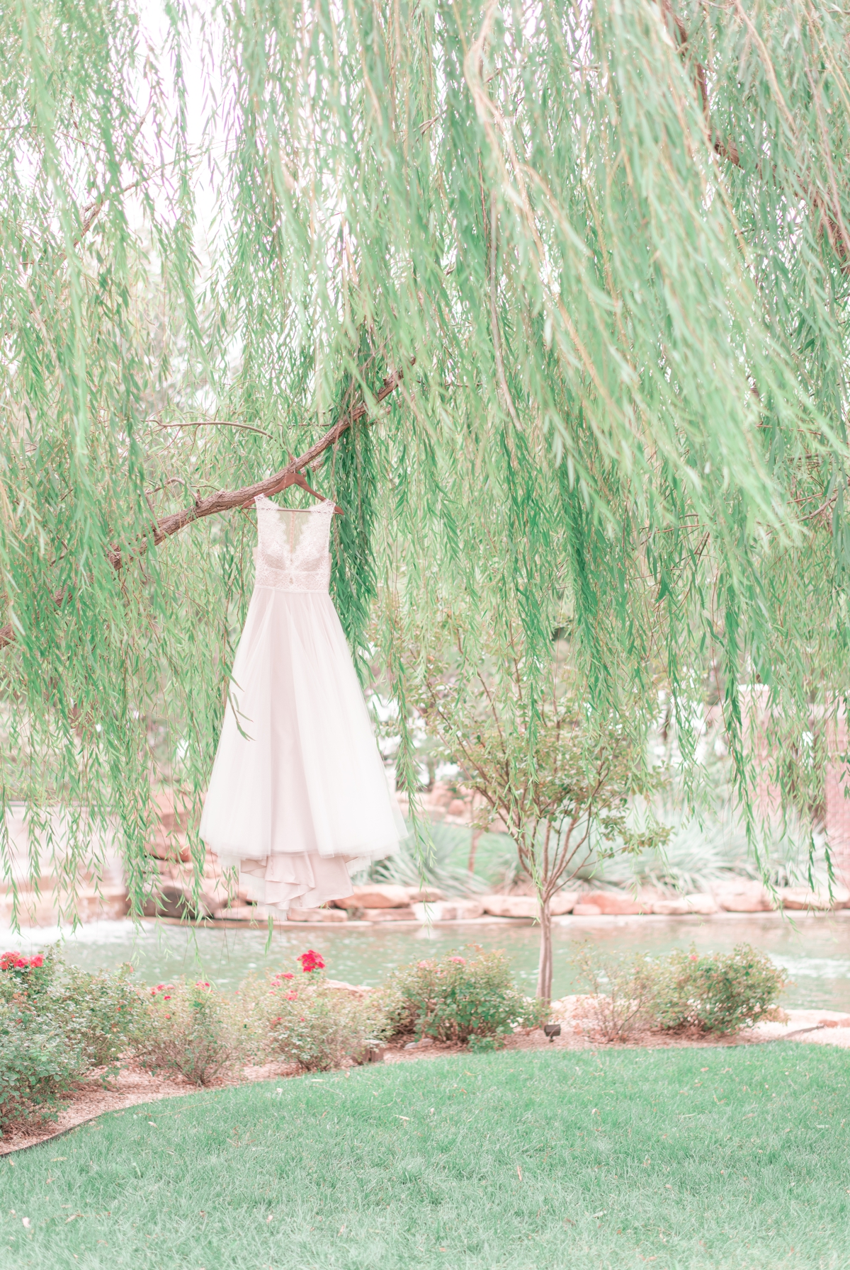wedding dress hanging outside of the wedding venues lubbock willows event center